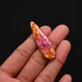 Close-up of polished tear-drop sea sediment jasper stone pendant with vibrant pink hues - Pink Orange Yellow Marbling Style (No. 11)