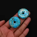 Close-up of two bright blue turquoise donut charms held in hand with black background - Style 4 (Sky Blue Marble) / 30mm
