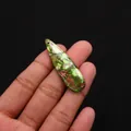 Water-drop imperial stone pendant with green brown mottling held in hand - Imperial Jasper Green Brown Beige Style (No. 8)