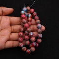 Polished synthetic imperial jasper round beads in vibrant red with blue marbled texture - Red Blue Ink Texture (No. 22)