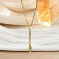 Elegant gold spoon necklace with crown pendant and crystals on a luxury silk background - Gold Spoon Style (XL02464)