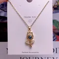 Macro detail of tulip pendant necklace with dark gemstone and micro-inlaid rhinestones - Tulip Shape (TY0042) / Gold