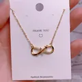 Detail of infinity pendant necklace in gold finish with sparkling pavé crystals - Simple Pave Infinity Style (SQ0013)