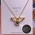 Exquisite goldene Engelsflügel-Halskette mit 100 Sprachen Ich liebe dich Projektion - Engelsflügel Design(TY0087)