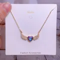 Detail of winged heart necklace with purple gradient crystal on a jewelry display card - Heart Gradient Crystal Gold Wings Style (CB04)
