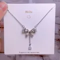 Collier en titane argenté avec pendentif aile de cœur et pierres de zircon scintillantes - Style Pompon Strass Blanc Argent Forme Papillon (CB08)