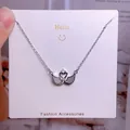 Collier cœur cygne argenté avec ailes grises et pierres de zircon scintillantes - Style Strass Argent Cœur Double Cygne (CB09)