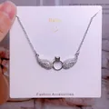 Collier en acier titane argenté avec ailes serties de diamants et pendentif en forme de cœur - Style Pierre Centrale Anneau Ailes Argent (CB14)