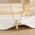 Detailed macro of 18K gold plated K letter pendant necklace with sparkling micro zircons - Letter K