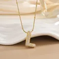 Detail showing gold letter L pendant with micro-paved cubic zirconia on a snake bead chain - L