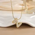 Detailed view of a gold-tone Z-letter pendant featuring micro-paved zircons on a snake chain - Letter Z