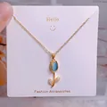 Élégant collier tulipe doré avec pendentif opale bleue et accents en zircon étincelants - Style Tulipe Goutte d'eau Pierre Bleue (YJX0028)
