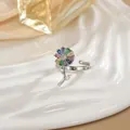 Macro detail of rotating flower ring with colorful zircon petals on white ceramic - Colorful Petal Style (68)