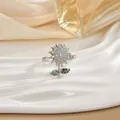 Macro detail of a sunflower ring with sparkling cubic zirconia on a white silk tray - Sunflower Bee Style (73)