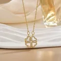 Golden four-leaf clover necklace with sparkling heart-shaped zircon pendants on gold chain - Hollow Heart Gold (XL0542)