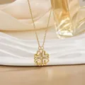 Golden heart-shaped four-leaf clover necklace with sparkling diamonds on satin background - Zirconia Inlaid Gold (XL0551)