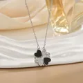 Magnetic four-leaf clover heart necklace in silver finish on a white display stand - Black White Enamel Silver (XL0547G)