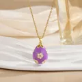 Detail of purple enamel egg pendant with gold-plated floral pattern and zircon stone - Purple Small Floral Style (XL0650)