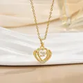 Macro shot of gold-plated heart necklace featuring a dancing central zircon crystal - Nested Heart Style (灵动系列40) / Gold