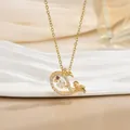 Macro detail of whale tail pendant in gold with sparkling zircons and a purple gem - Cute Fish Style (灵动系列43) / Gold
