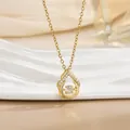 Close-up of golden dancing stone necklace with teardrop pendant on elegant white ceramic - Jewel-set Water Drop Style (灵动系列44) / Gold