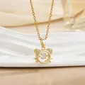 Macro detail of dancing stone gold cat pendant with shimmering cubic zirconia accents - Dancing Cat Head Style (灵动系列53) / Gold