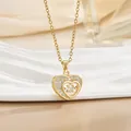 Detail shot of the gold heart pendant with sparkling pavé crystals and central round stone - Double Nested Heart (灵动系列59) / Gold