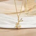 Close-up of golden fairy pendant with sparkling zircon wings and dancing center stone - Dancing Fairy Style (灵动系列51) / Gold