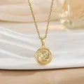 Detail view of gold spinning pendant with lucky Chinese engraving and center zircon - Round Windmill Style (XL0953)