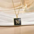 Macro view of gold stainless steel necklace with black enamel square FE letter pendant - Gold Square Black Enamel Letter (XL1103B)