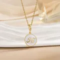 Macro shot of gold necklace featuring white enamel round pendant with Fe letters and heart - Gold Round White Enamel Letter Heart (XL1104)
