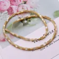 Macro shot of natural spiral shell cylinder beads for DIY jewelry making - 3.5x3.5mm, 9g / Natural
