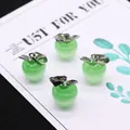 Set van vier lichtgroene opaalstenen hangers in appelvorm met zilveren bladaccenten - 14x21mm / Groene Kattenoogsteen