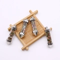 Stenen hanger set met groene en roze kristallen en zilveren Love-gravure op metaal - Unakiet