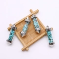 Set van vier lichtblauwe cilinderhangers met zilveren Love-gravering - Blauw Turkoois