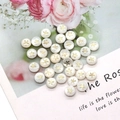 Macro detail of round white pearl beads with golden star inlay for DIY jewelry design - Floral Print / 8mm 20 Pieces Per Pack