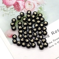 Detail view of black shell beads with golden turtle print for DIY jewelry crafting - Turtle Pattern / 8mm 20 Pieces Per Pack