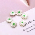 Macro detail of six white daisy shell beads with green centers for jewelry making - 10mm / Green Center (No.2)