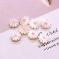 Detail shot of daisy-shaped natural shell beads with white petals and pink center core - 10mm / Pink Center (No.3)