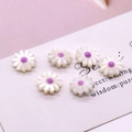 Detailed macro view of white daisy pearl beads with purple centers for DIY jewelry making - Purple Center (No.5)