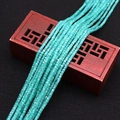 Close-up of faceted light blue zircon beads layered on a vintage wooden gift box - Light Blue (No.3) / 2.5x2.5mm