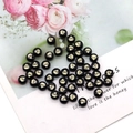 Close-up of black round shell beads with golden diamond pattern for DIY jewelry making - Diamond Shape Pattern / 8mm 20 Pieces Per Pack