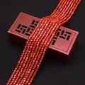 Détail macro de perles de zircon facettées orange multicouches sur une boîte en bois décorée - Rouge Orangé Foncé (No. 9)