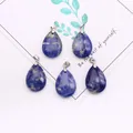 Close-up of five teardrop-shaped blue natural stone pendants with silver metal clasps - 18x25mm / Blue Sodalite
