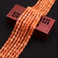 Macro shot of faceted orange cat-eye stone beads in teardrop shape for DIY jewelry making - No. 12 (Orange Yellow)