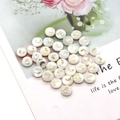 Macro detail of natural white shell round beads featuring golden crescent moon patterns - Moon Print / 8mm 20 Pieces Per Pack