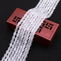 Faceted white teardrop cat's eye stone beads on a vintage wooden jewelry box - 4x6MM / No.3 (White)