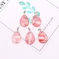 Detailed view of five teardrop pink crystal stone pendants with silver clasps - 18x25mm / Watermelon Quartz
