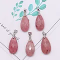 Detailed macro view of five faceted pink teardrop natural stone pendants with silver clasps - 13x25mm / Rhodonite