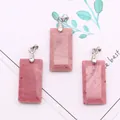 Detailed macro view of three rectangular pink natural stone pendants with silver metal bails - 3-Pack / Rhodonite